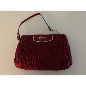 Red satin ruched Coach wristlet